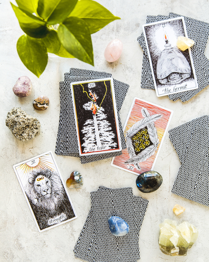 tarot cards, crystals, and plants flatlay composition